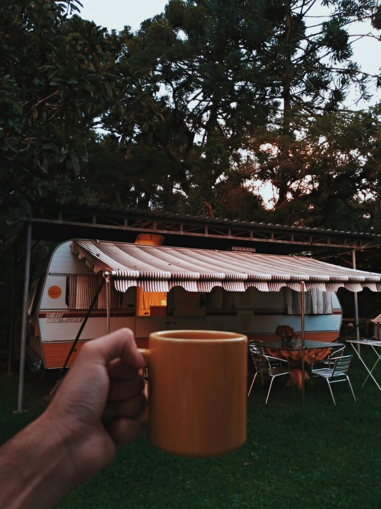 Person Holding Orange Mug